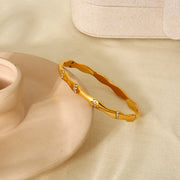 Radiance Elegance 18k Gold Wave Bangle